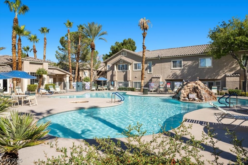 2152 Quarry Ridge Street, Unit 207 Las Vegas, NV 89117 - Photo 33 of 37 Community pool featuring a patio and a residential view
