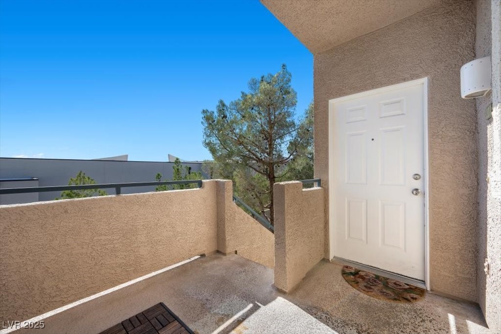 2152 Quarry Ridge Street, Unit 207 Las Vegas, NV 89117 - Photo 4 of 37 Entrance to property featuring stucco siding