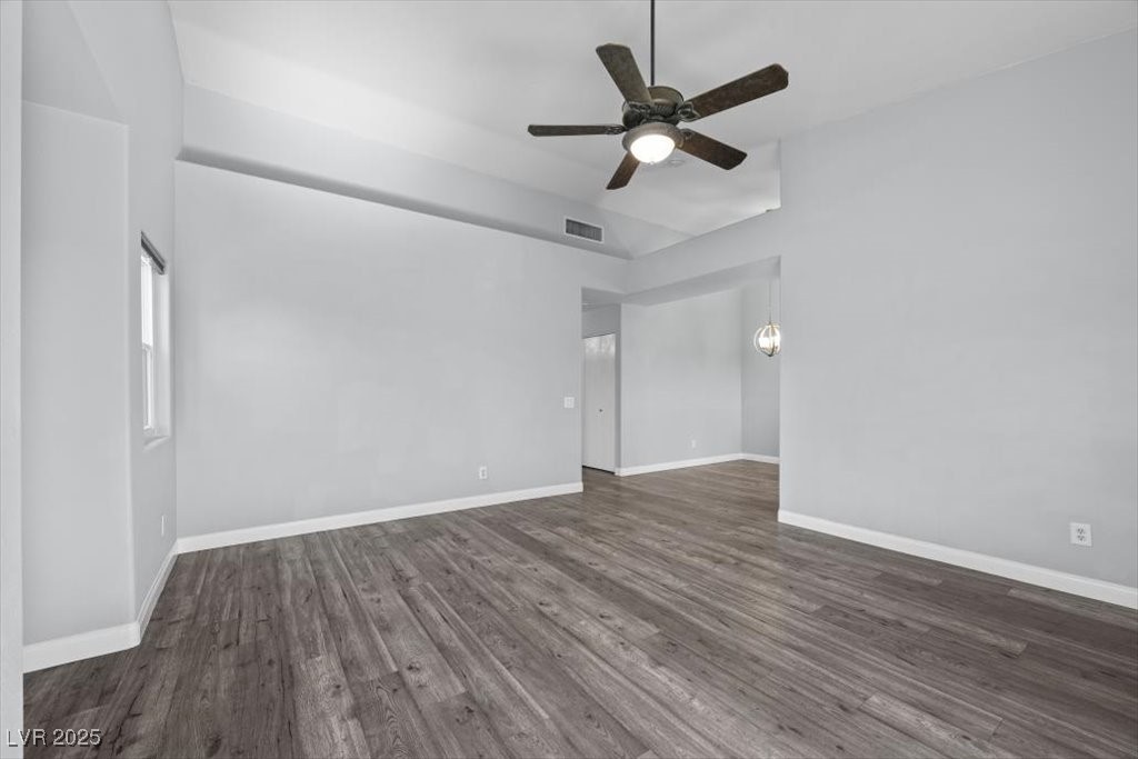 2152 Quarry Ridge Street, Unit 207 Las Vegas, NV 89117 - Photo 7 of 37 Living room featuring dark wood finished floors and ceiling fan
