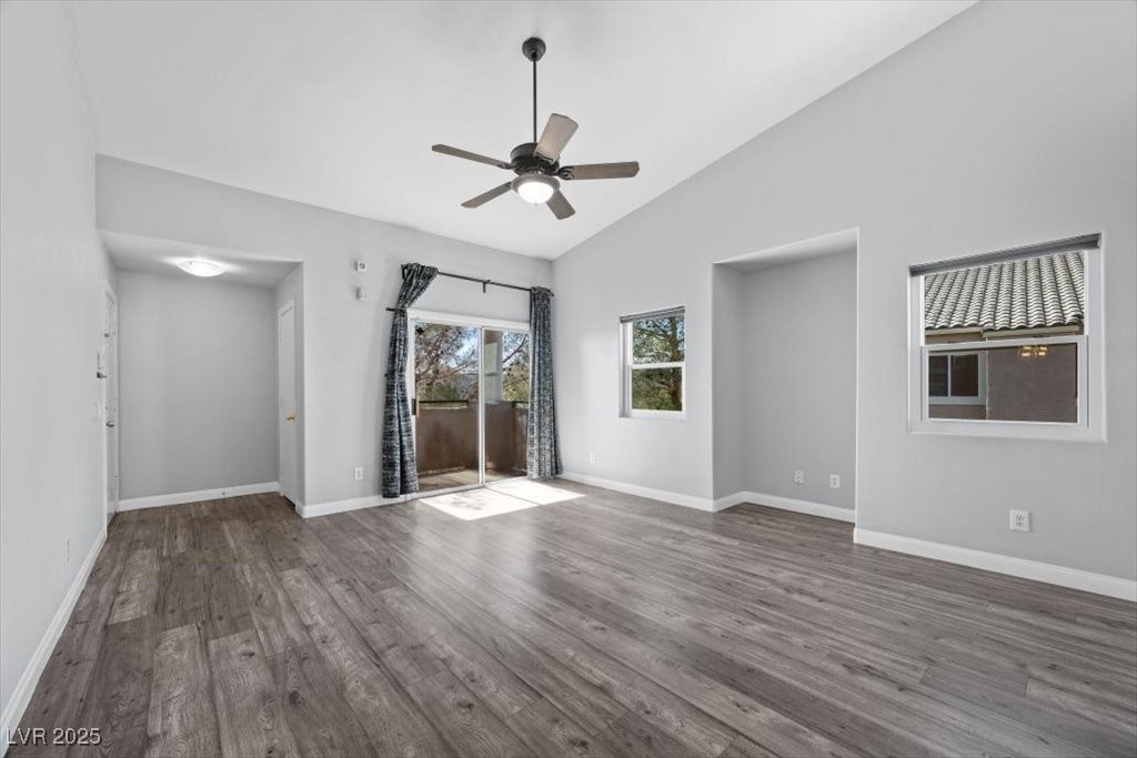 2152 Quarry Ridge Street, Unit 207 Las Vegas, NV 89117 - Photo 9 of 37 Living area with wood-style flooring, vaulted ceiling, and ceiling fan
