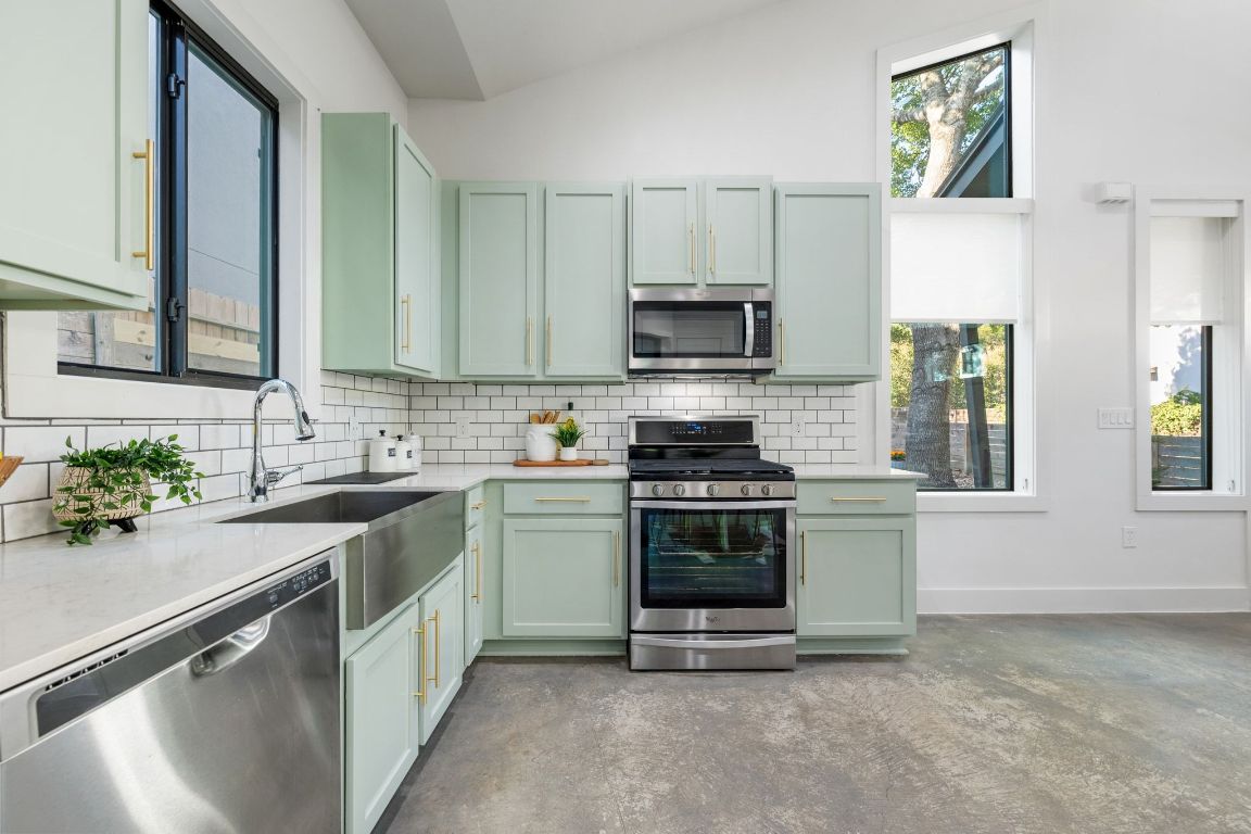1118 Algarita Avenue, Unit 1 Austin, TX 78704 - Photo 11 of 26 a kitchen with a sink stove and microwave