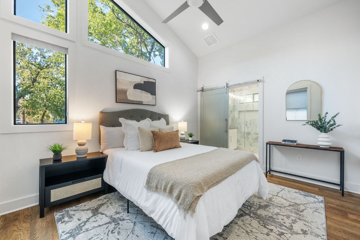 1118 Algarita Avenue, Unit 1 Austin, TX 78704 - Photo 12 of 26 a bedroom with a bed and a potted plant