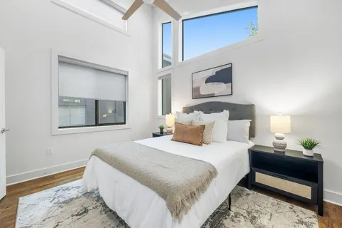 a bedroom with bed and a window