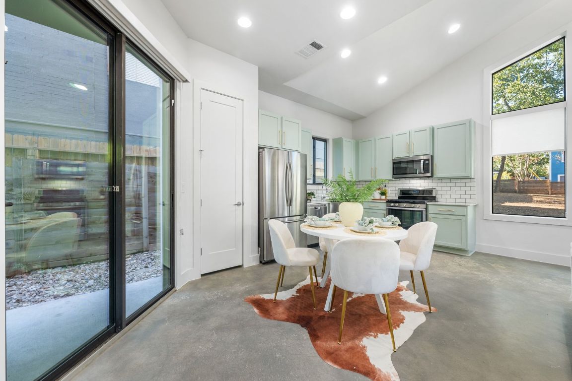 1118 Algarita Avenue, Unit 1 Austin, TX 78704 - Photo 8 of 26 a view of a dining room with furniture window and outside view