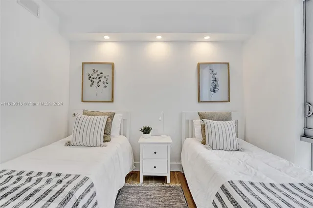 a bathroom with a sink a chair and a mirror