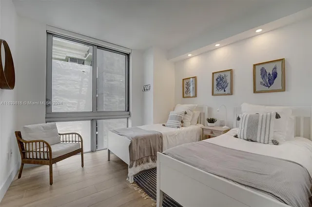 a bedroom with a bed and a couch