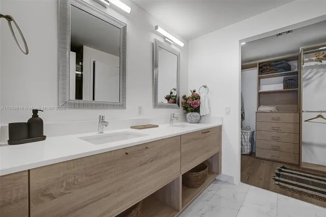 a bathroom with a shower and a sink