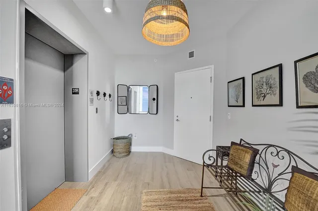a view of a livingroom with furniture and wooden floor