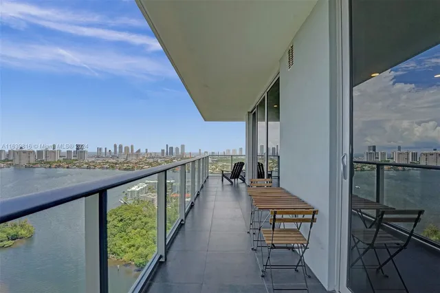 a view of a balcony with furniture