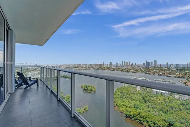 a view of a lake with a yard