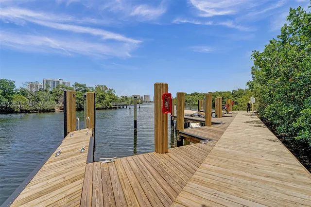 swimming pool view with a seating space