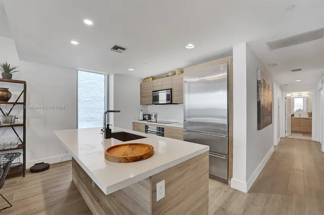 a room with furniture pool view and a wooden floor