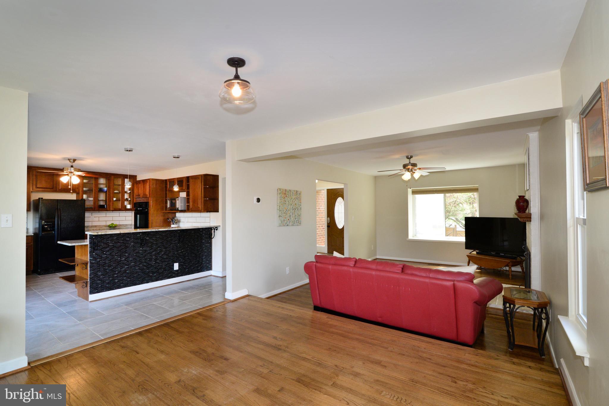11086 Glade Court Reston, VA 20191 - Photo 11 of 44 The dining room opens to the kitchen & living room