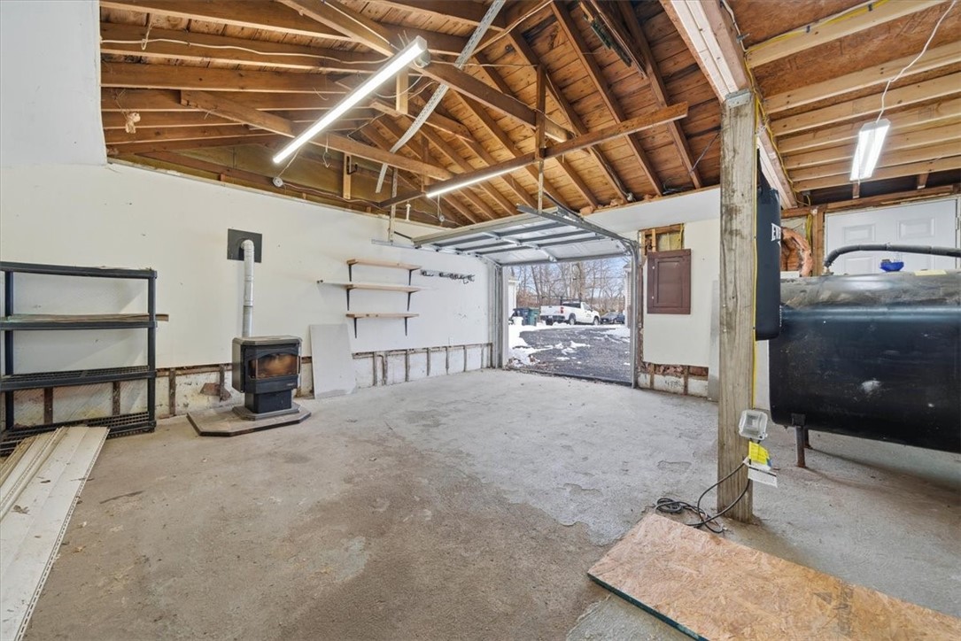22 Colorado Street Coventry, RI 02816 - Photo 29 of 39 Pellet Stove in Garage for heat