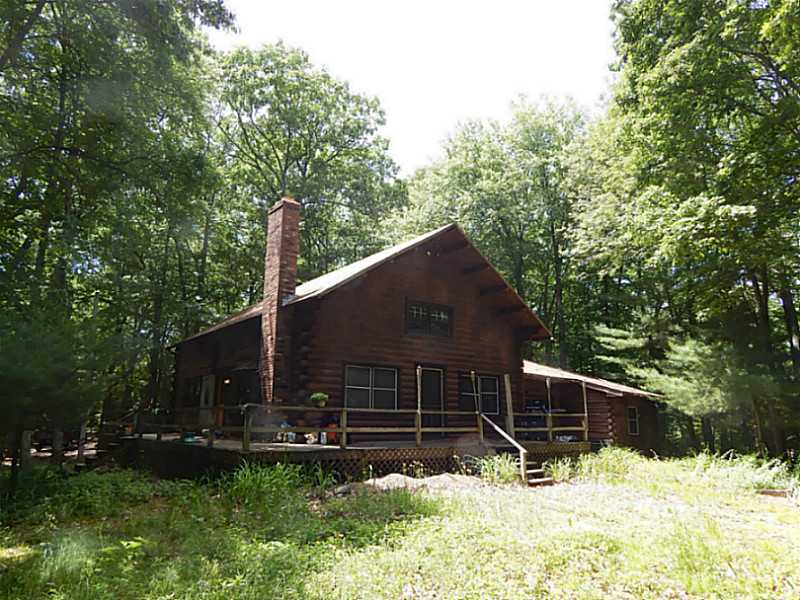 Exterior Front. Log located on waterman s lake.