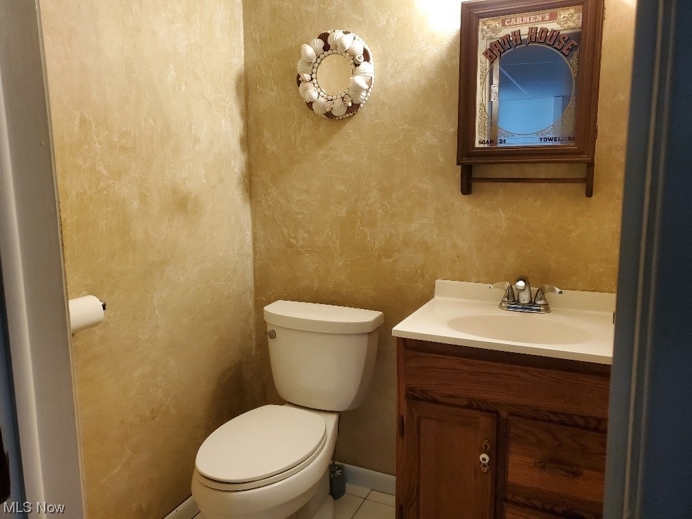 12221 Reno Drive Parma, OH 44130 - Photo 28 of 29 Bathroom featuring tile flooring, vanity, and toilet