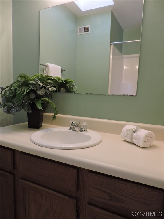 5810 Mill Spring Road Midlothian, VA 23112 - Photo 22 of 23 a bathroom with a sink and a mirror