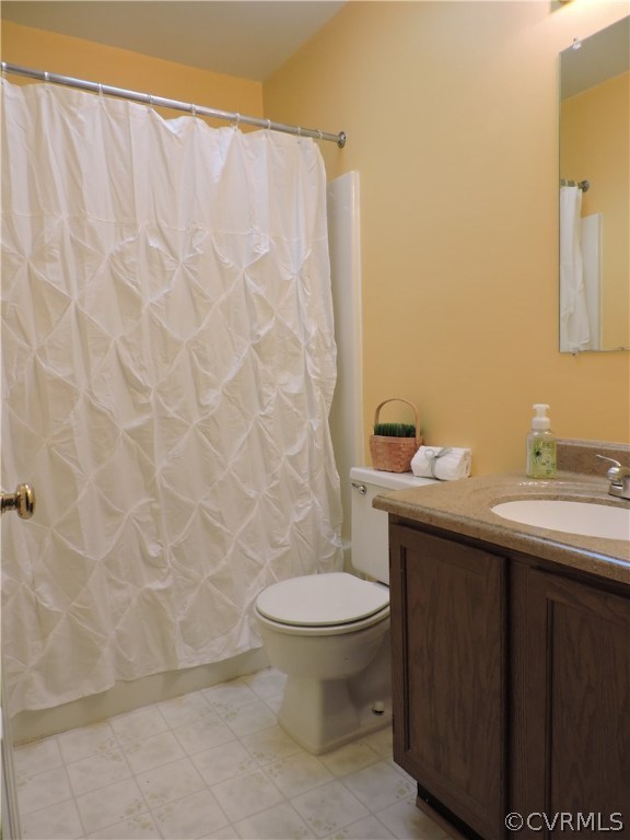 5810 Mill Spring Road Midlothian, VA 23112 - Photo 23 of 23 a bathroom with a sink a toilet and a mirror