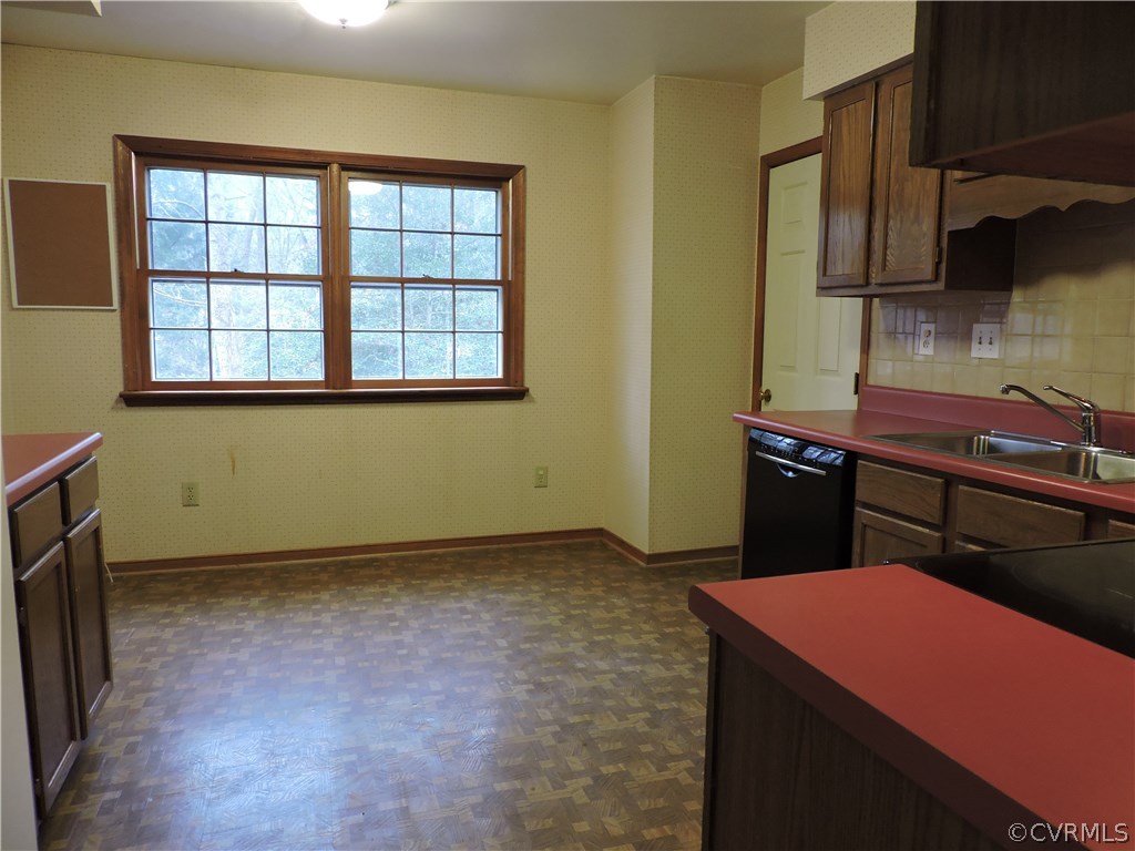 5810 Mill Spring Road Midlothian, VA 23112 - Photo 8 of 23 a kitchen with a sink and a stove