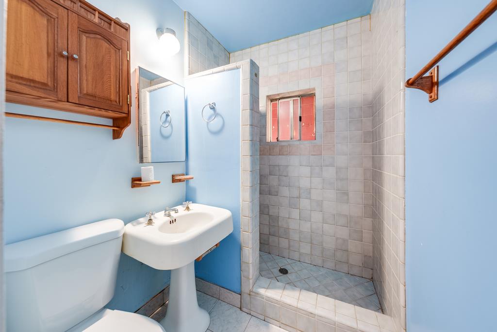 900 Mesa Grande Road Aptos, CA 95003 - Photo 20 of 30 a bathroom with a sink a toilet and shower