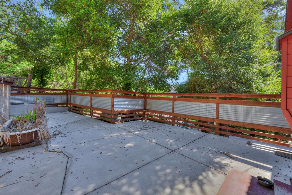 900 Mesa Grande Road Aptos, CA 95003 - Photo 6 of 30 a view of a backyard with a table and chairs