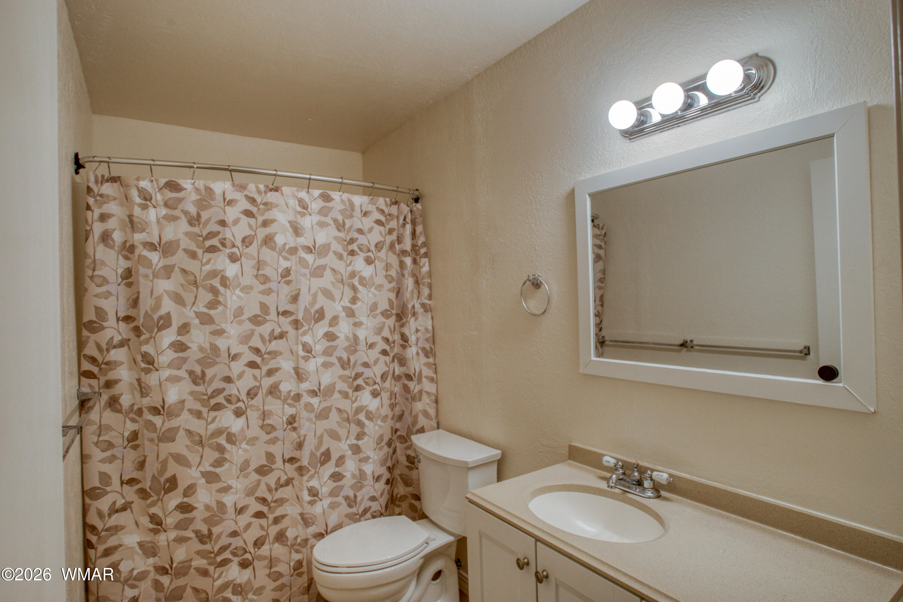 411 West Stratton Show Low, AZ 85901 - Photo 17 of 47 a bathroom with a sink toilet and shower