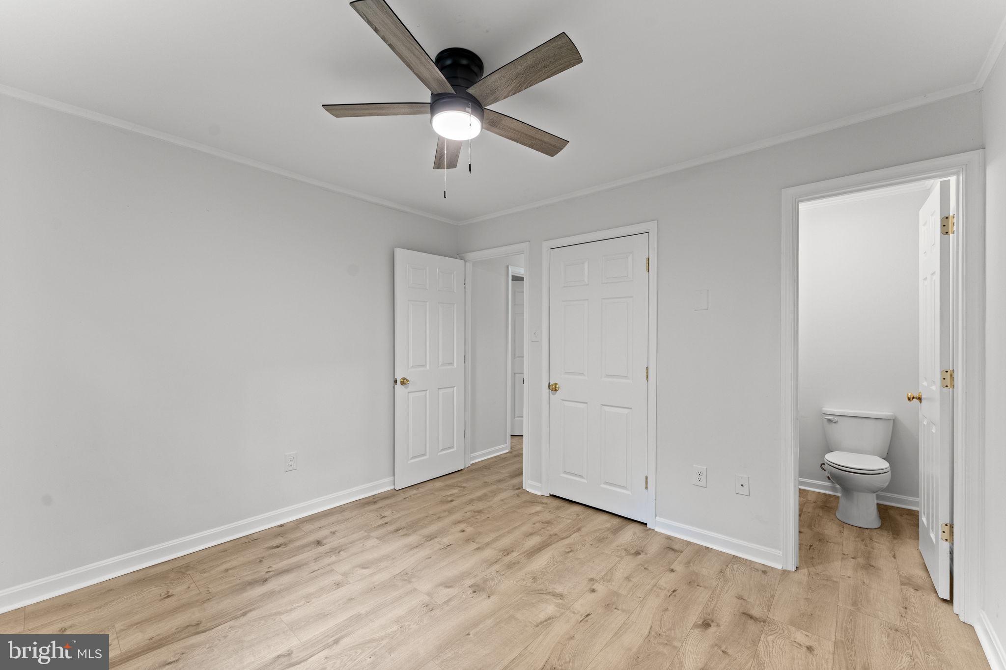 1821 James City Road Reva, VA 22735 - Photo 31 of 44 wooden floor in an empty room with a bathroom