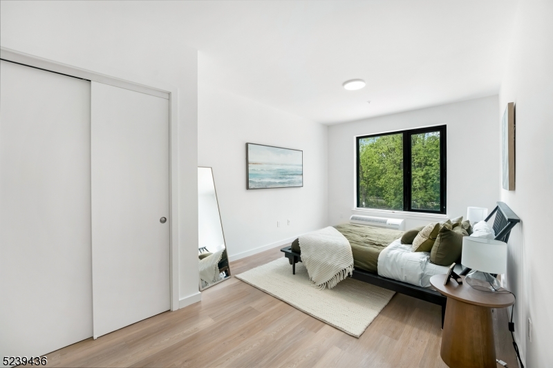 803 South Avenue, Unit 507 Plainfield, NJ 07062 - Photo 19 of 45 a living room with furniture and a large window