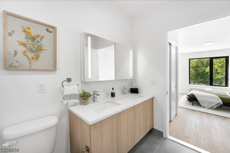 803 South Avenue, Unit 507 Plainfield, NJ 07062 - Photo 25 of 45 a bathroom with a sink and a toilet