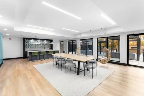a view of a dining room with furniture window and outside view