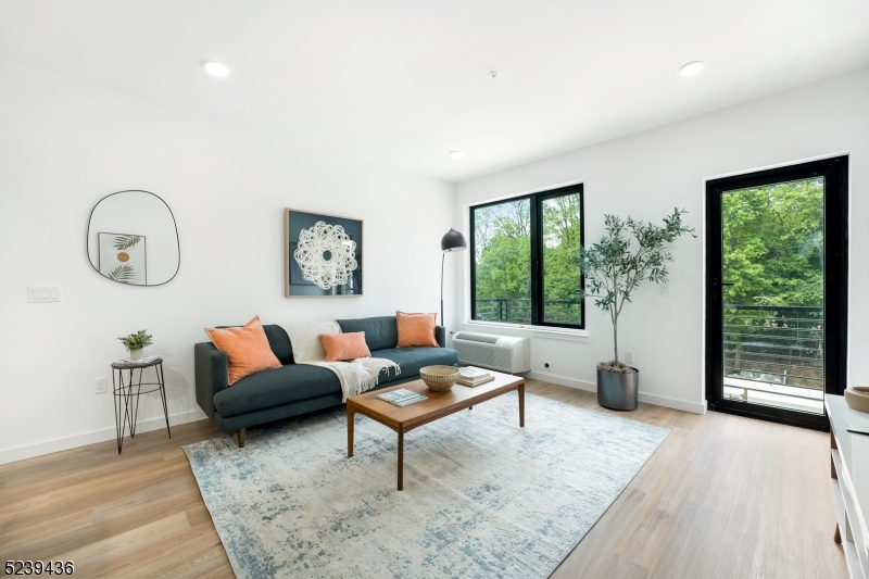 803 South Avenue, Unit 507 Plainfield, NJ 07062 - Photo 9 of 45 a living room with furniture and a large window