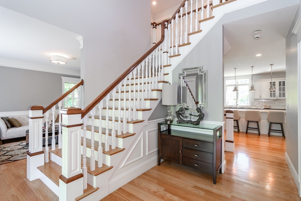 2 Hunters Lane Natick, MA 01760 - Photo 4 of 40 a view of entryway dining room and hall with wooden floor