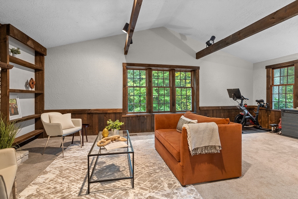35 Oxbow Lane Groton, MA 01450 - Photo 14 of 34 a living room with furniture ceiling fan and a rug