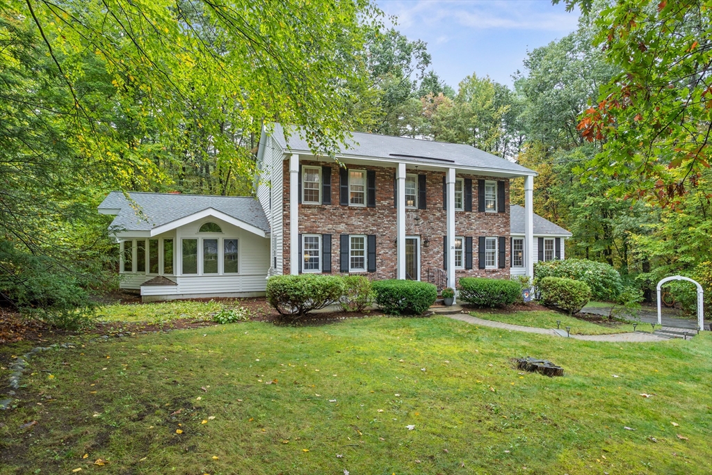 35 Oxbow Lane Groton, MA 01450 - Photo 2 of 34 a front view of a house with a yard