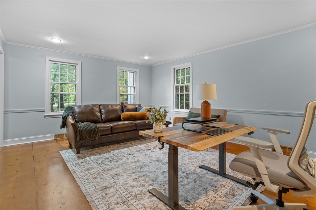 35 Oxbow Lane Groton, MA 01450 - Photo 23 of 34 a living room with furniture a window and a table