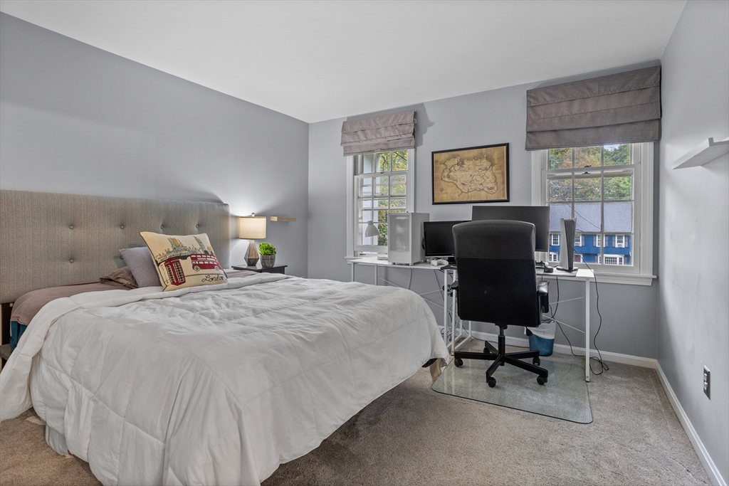 35 Oxbow Lane Groton, MA 01450 - Photo 25 of 34 a bed room with a bed and a chair