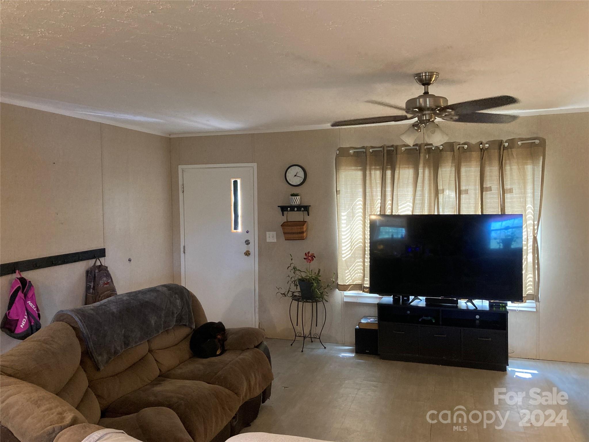 1739 Mary D Road, Unit 10 Chesterfield, SC 29709 - Photo 3 of 5 a living room with furniture and a flat screen tv