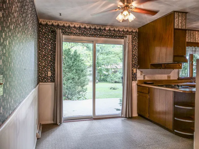 a kitchen with a large window and a sink