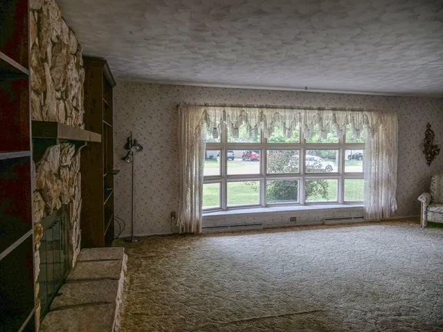 a view of an empty room with a window