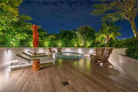 a view of an outdoor sitting area with swimming pool