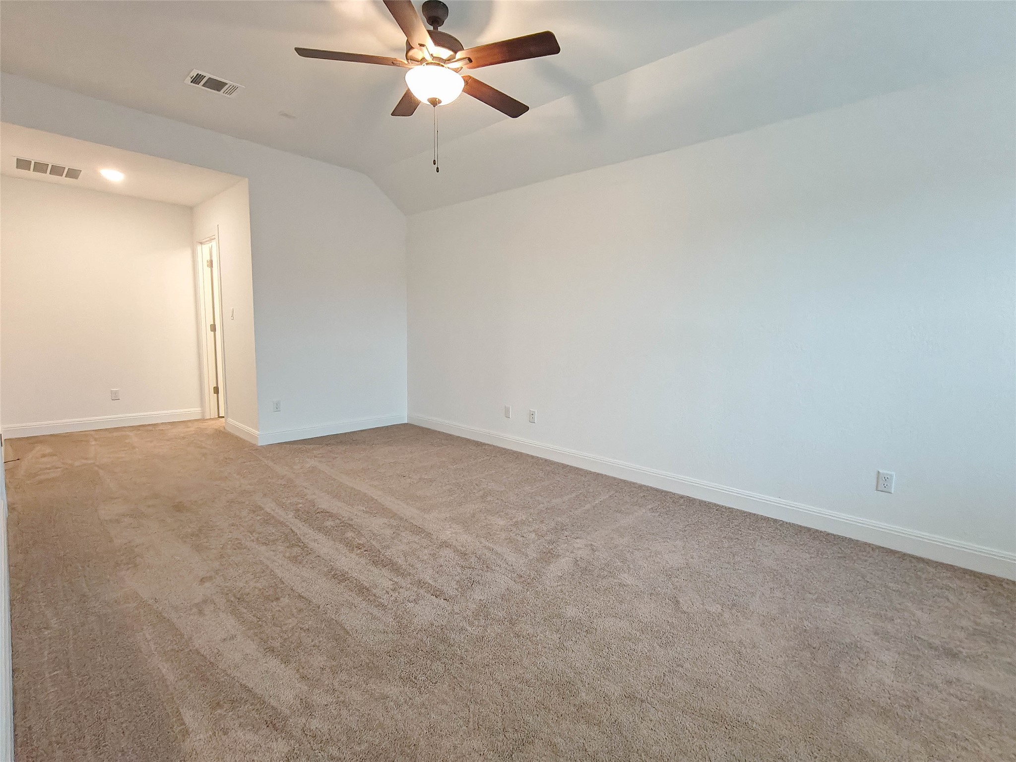 200 Fiddleneck Road Marble Falls, TX 78654 - Photo 21 of 37 an empty room with windows and fan