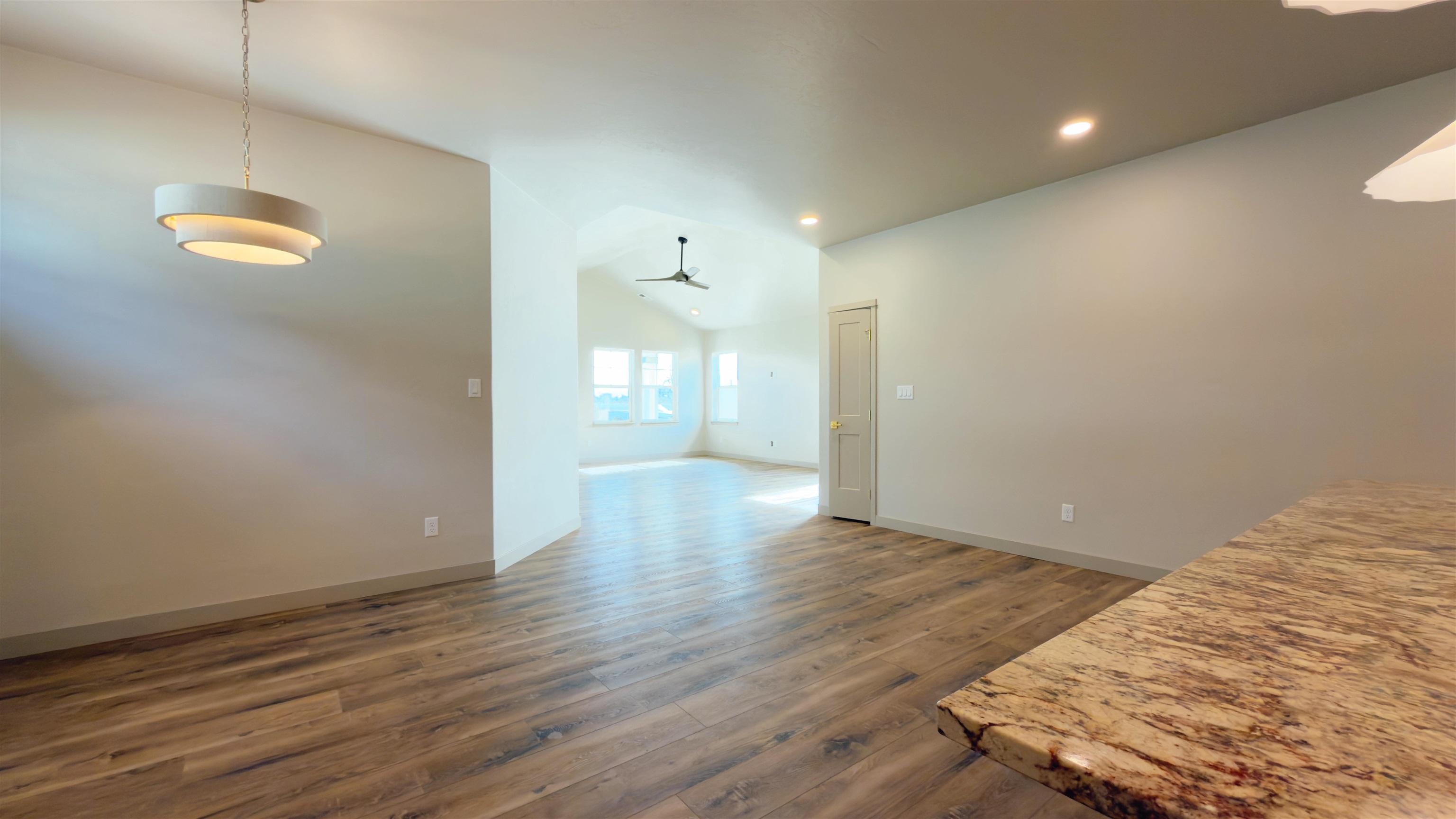 2003 Korima Drive Fruita, CO 81521 - Photo 5 of 19 a view of an empty room with wooden floor and a window
