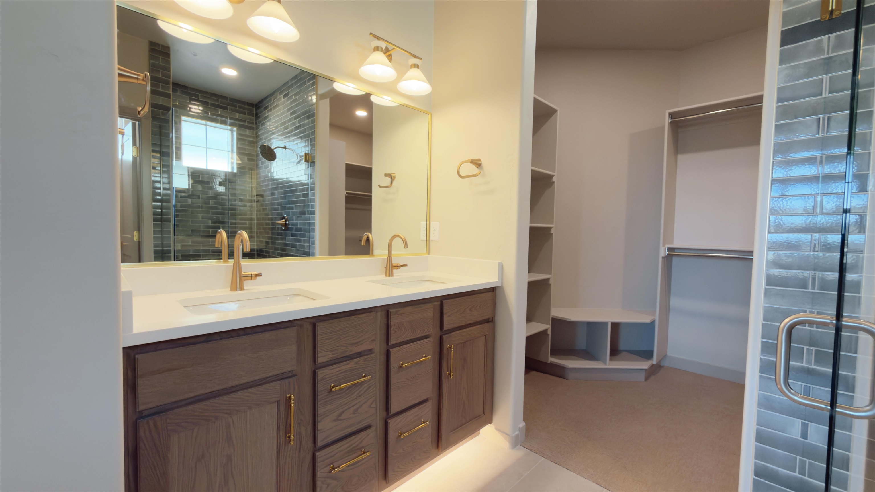2003 Korima Drive Fruita, CO 81521 - Photo 10 of 19 a bathroom with a double vanity sink a mirror and shower