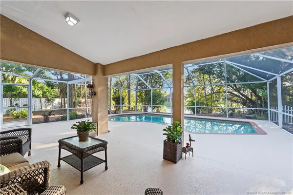 a living room with furniture and garden