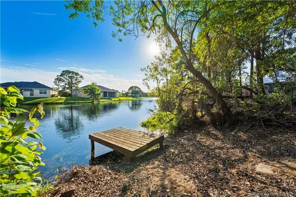 a view of a lake with outdoor seating