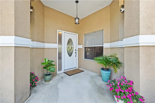 a flower pot with a potted plant