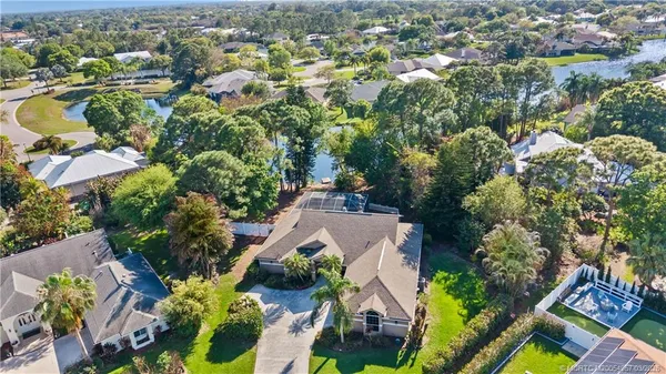 an aerial view of residential house with outdoor space and swimming pool