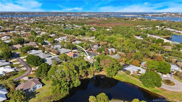 an aerial view of residential houses with outdoor space