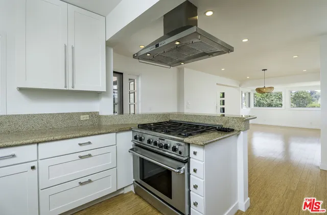 wooden floor in an empty room with a fireplace