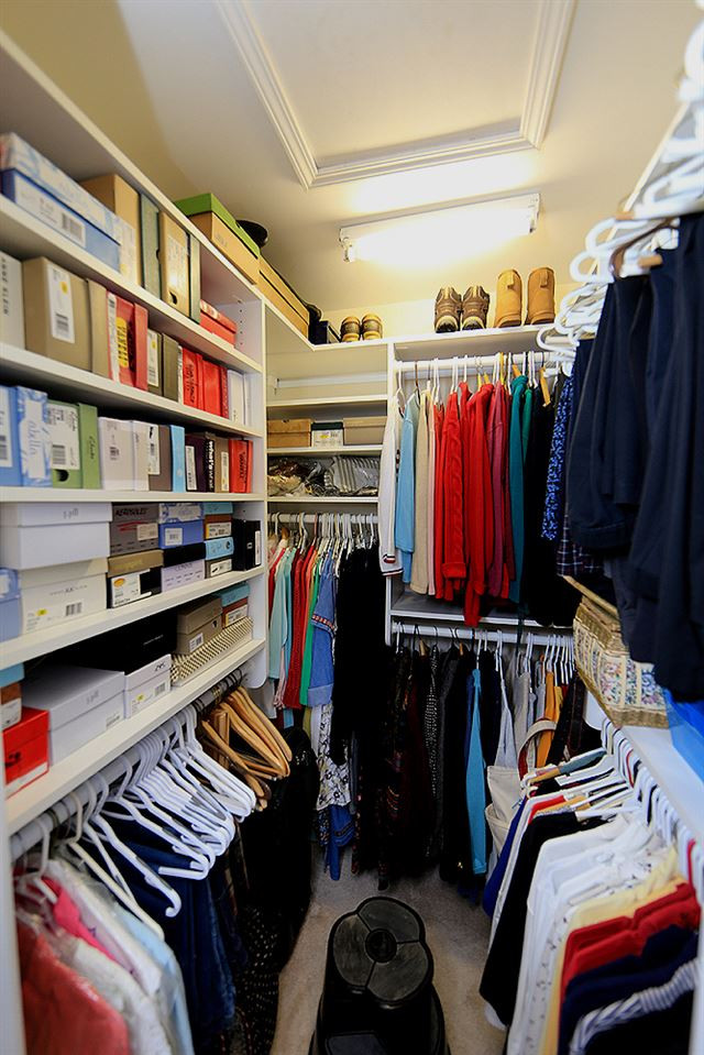 2041 Rivergate Road, Unit 103 Raleigh, NC 27614 - Photo 11 of 21 Check out this great custom walk-in closet, one of TWO in the master suite! Walk-in Closet